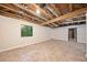 Bright, unfinished basement featuring tile flooring, neutral walls and exposed ceiling at 766 Lost Creek Cir, Stone Mountain, GA 30088