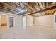 Unfinished basement with tile flooring, exposed ceiling beams and ductwork, and neutral walls at 766 Lost Creek Cir, Stone Mountain, GA 30088