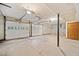 Large basement garage with multiple doors providing ample space for vehicles and equipment at 766 Lost Creek Cir, Stone Mountain, GA 30088