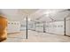 Basement garage with access door, with additional storage and workspace at 766 Lost Creek Cir, Stone Mountain, GA 30088