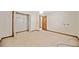 Bedroom offers an open closet, neutral carpet, and access to other rooms at 766 Lost Creek Cir, Stone Mountain, GA 30088