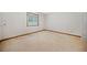 Neutral bedroom offering a window for natural light and neutral carpeting at 766 Lost Creek Cir, Stone Mountain, GA 30088