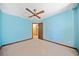 Cozy bedroom with wood trim, neutral carpet, and access to other rooms at 766 Lost Creek Cir, Stone Mountain, GA 30088
