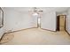 Large bedroom with neutral carpet, access to the bathroom, and natural light at 766 Lost Creek Cir, Stone Mountain, GA 30088