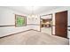 Bright dining room with classic trim, a chandelier, and access to the kitchen through an open doorway at 766 Lost Creek Cir, Stone Mountain, GA 30088