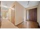 Bright foyer with hardwood flooring, a windowed front door, and neutral paint at 766 Lost Creek Cir, Stone Mountain, GA 30088