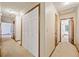 Bright hallway features neutral carpeting and ample closet space for storage at 766 Lost Creek Cir, Stone Mountain, GA 30088