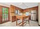 Kitchen featuring rich wood cabinetry, modern stainless steel appliances, and a sunlit window at 766 Lost Creek Cir, Stone Mountain, GA 30088
