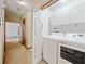 Well-equipped laundry room with cabinetry for storage and modern washer and dryer at 766 Lost Creek Cir, Stone Mountain, GA 30088