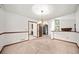 Cozy living area with classic trim, chandelier, fireplace, and an open layout flowing into other spaces at 766 Lost Creek Cir, Stone Mountain, GA 30088