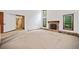 Bright living area with a stone fireplace, large windows, and a cozy atmosphere at 766 Lost Creek Cir, Stone Mountain, GA 30088