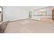 Living area featuring a stone fireplace, lots of natural light, and an open layout at 766 Lost Creek Cir, Stone Mountain, GA 30088