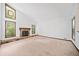 Spacious living room with a stone fireplace and large windows for ample light at 766 Lost Creek Cir, Stone Mountain, GA 30088