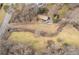 Bird's eye view showcases the house, long driveway, surrounding landscape, and bordering creek at 1036 Wooten Lake Nw Rd, Kennesaw, GA 30144