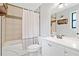 A bathroom featuring a shower/tub and a white vanity with storage at 130 Sunnybrook Ln, Woodstock, GA 30188