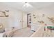 Bright and airy bedroom with a crib and chair at 130 Sunnybrook Ln, Woodstock, GA 30188