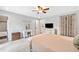 A Primary bedroom featuring a vanity, TV and access to the bathroom at 130 Sunnybrook Ln, Woodstock, GA 30188