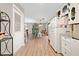 Open concept kitchen flows into dining area with abundant natural light at 130 Sunnybrook Ln, Woodstock, GA 30188