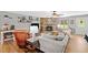 Inviting living room featuring a stone fireplace, neutral walls, and wood-look floors at 130 Sunnybrook Ln, Woodstock, GA 30188
