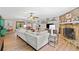 Spacious living room featuring a stone fireplace, ceiling fan, and open layout at 130 Sunnybrook Ln, Woodstock, GA 30188