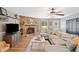 Inviting living room boasts a stone fireplace and cozy sectional sofa at 130 Sunnybrook Ln, Woodstock, GA 30188