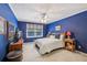 Blue bedroom featuring a bed, window, and matching nightstands for a cohesive design at 1487 W Bend Creek Ct, Atlanta, GA 30338