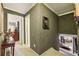 Upstairs hallway featuring neutral walls, carpeted floor, and an open staircase at 1487 W Bend Creek Ct, Atlanta, GA 30338