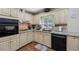 Well-equipped kitchen showcasing granite countertops, tiled backsplash, and modern appliances at 1487 W Bend Creek Ct, Atlanta, GA 30338
