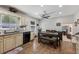 Bright eat-in kitchen features granite countertops, stainless steel appliances, and hardwood floors at 1487 W Bend Creek Ct, Atlanta, GA 30338