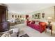 Formal living room with neutral carpet, colorful sofa, and elegant decor at 1487 W Bend Creek Ct, Atlanta, GA 30338
