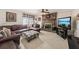 Inviting living room with a fireplace, large leather sofa, and plenty of space at 1487 W Bend Creek Ct, Atlanta, GA 30338