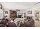 Warm living room featuring a brick fireplace, comfortable seating, and ample space at 1487 W Bend Creek Ct, Atlanta, GA 30338