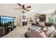 Spacious living room with stairs, leather sofa, and a TV for entertainment at 1487 W Bend Creek Ct, Atlanta, GA 30338