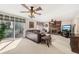 Cozy living room with a large leather sofa, sliding glass doors, and a fireplace at 1487 W Bend Creek Ct, Atlanta, GA 30338