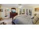 Bright main bedroom features neutral walls, ceiling fan, and private bathroom access at 1487 W Bend Creek Ct, Atlanta, GA 30338