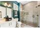 Contemporary bathroom features a glass-enclosed shower, stylish fixtures, and a vessel sink at 3233 Osborne Ne Rd, Brookhaven, GA 30319