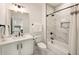 Bathroom with white marble tile, shower, and modern fixtures at 3233 Osborne Ne Rd, Brookhaven, GA 30319