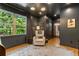 Charming bedroom features hardwood floors, neutral gray walls, a large window, and a cozy reading nook at 3233 Osborne Ne Rd, Brookhaven, GA 30319