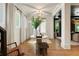 Bright entryway with hardwood floors, a round table, and white trim, creates a welcoming and airy atmosphere at 3233 Osborne Ne Rd, Brookhaven, GA 30319