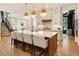 Bright and airy kitchen with a large center island, pendant lighting, and modern stainless steel appliances at 3233 Osborne Ne Rd, Brookhaven, GA 30319