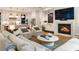 Cozy living room with fireplace, built-in cabinets and a view of the open kitchen at 3233 Osborne Ne Rd, Brookhaven, GA 30319