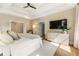 Spacious main bedroom featuring a large bed, hardwood floors, and modern fixtures at 3233 Osborne Ne Rd, Brookhaven, GA 30319