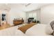 Comfortable main bedroom boasts a home office setup, bright white walls, and a neutral rug at 3233 Osborne Ne Rd, Brookhaven, GA 30319