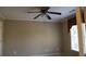 This bedroom offers a ceiling fan, carpeted floors, and a window with natural light at 4663 Mossey Dr, Lithonia, GA 30038