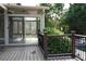 Enclosed deck with outdoor furniture, and a scenic view of the backyard at 4663 Mossey Dr, Lithonia, GA 30038