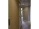 Well-lit hallway with neutral paint, trim, and carpet. An elevator is conveniently located nearby at 4663 Mossey Dr, Lithonia, GA 30038