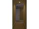 Narrow hallway with neutral walls and carpet at 4663 Mossey Dr, Lithonia, GA 30038