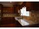Gourmet kitchen with granite countertops, stainless steel appliances, and custom wood cabinetry at 4663 Mossey Dr, Lithonia, GA 30038