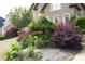 Beautifully landscaped front yard, with a variety of plants and vibrant colors at 4663 Mossey Dr, Lithonia, GA 30038