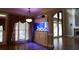 Bright living area features a built-in aquarium, hardwood floors, and decorative curtains at 4663 Mossey Dr, Lithonia, GA 30038